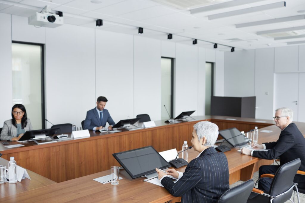 Picture of a board meeting in a conference room